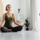 Relaxed,Young,Woman,Doing,Sitting,In,Yoga,Position,At,Home.